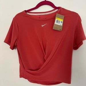 Women’s pink Nike athletic shirt. Size small
